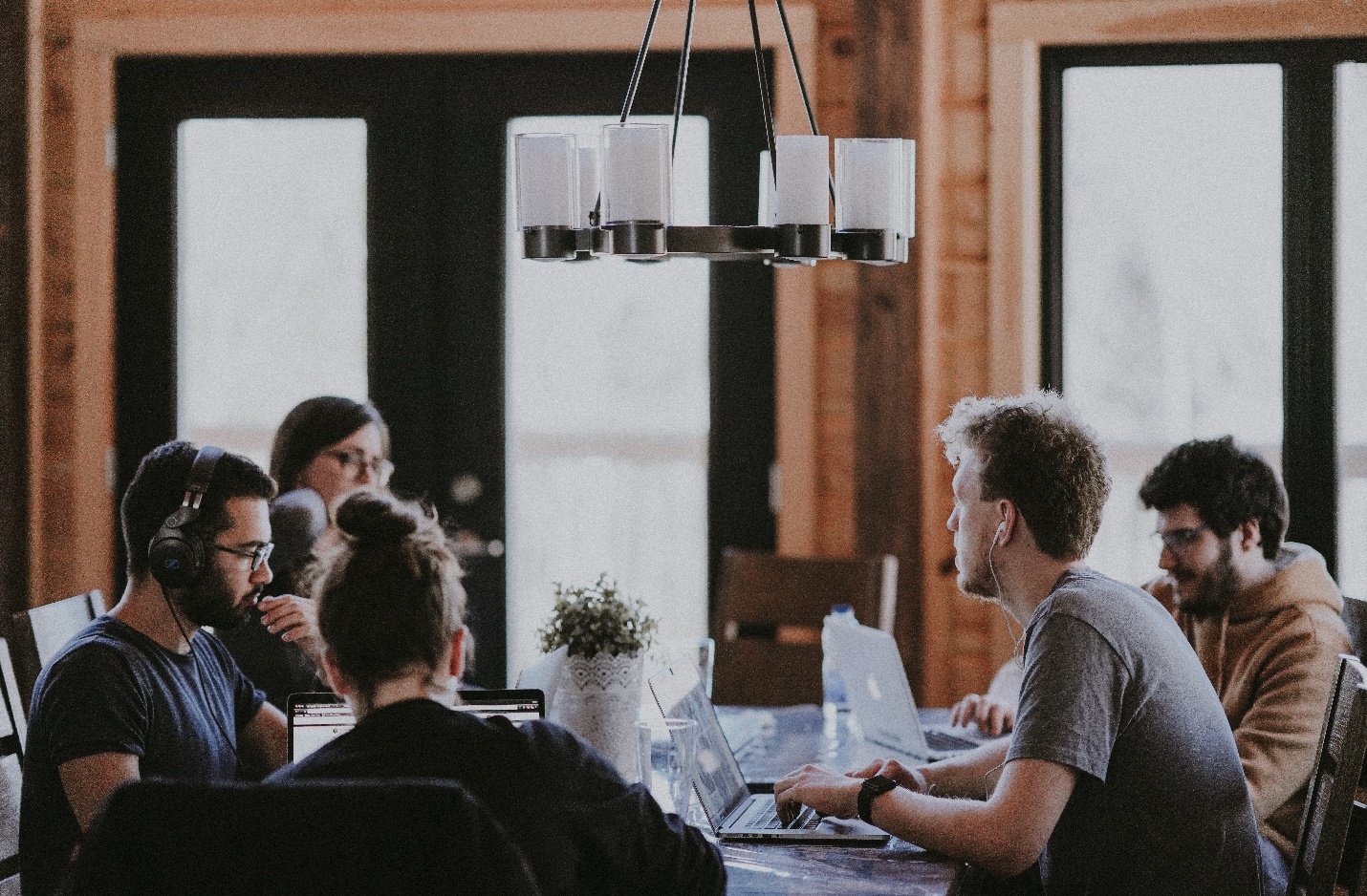 A group of people sitting around a table

Description automatically generated